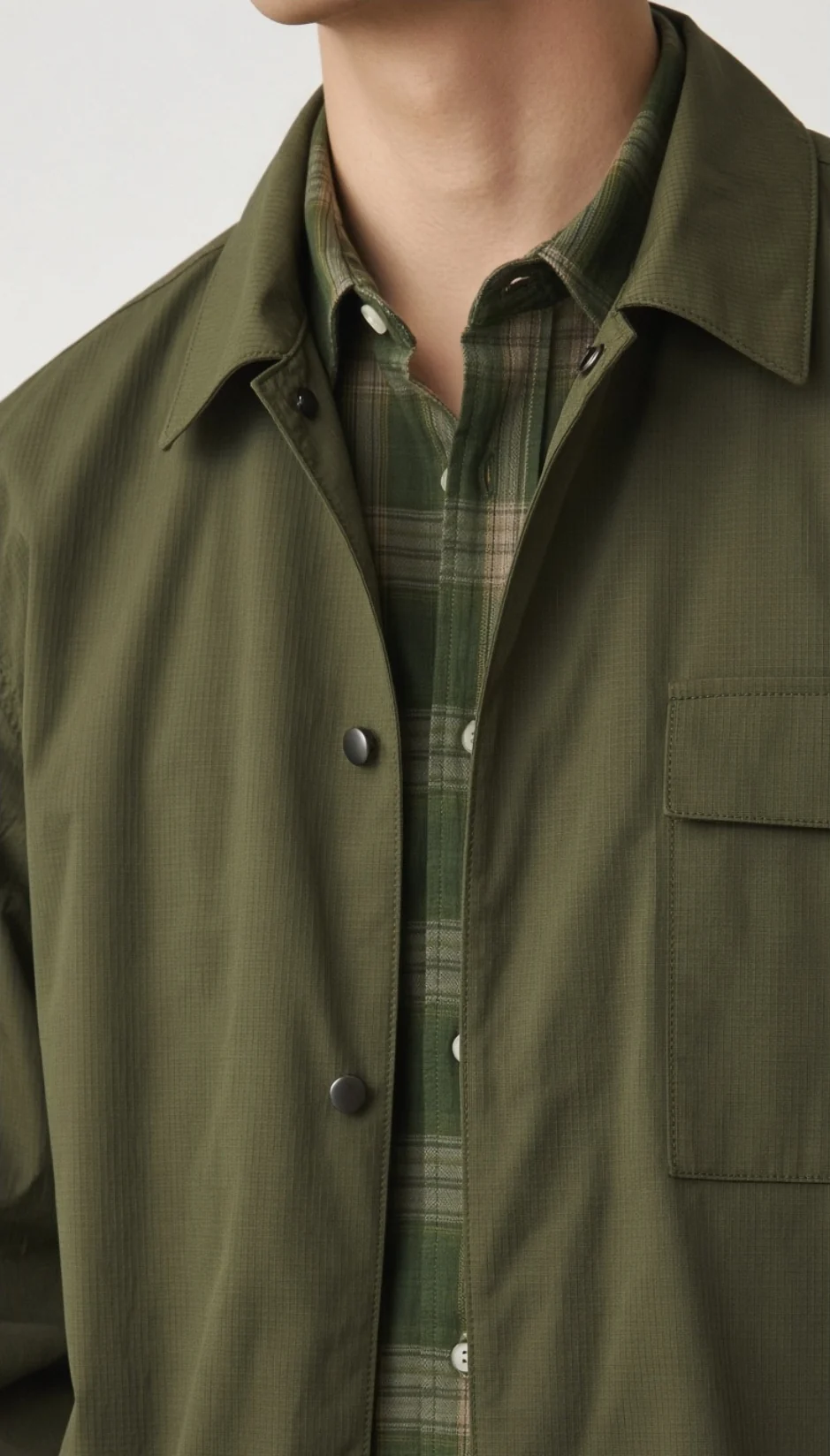 A cropped olive woven apparel look